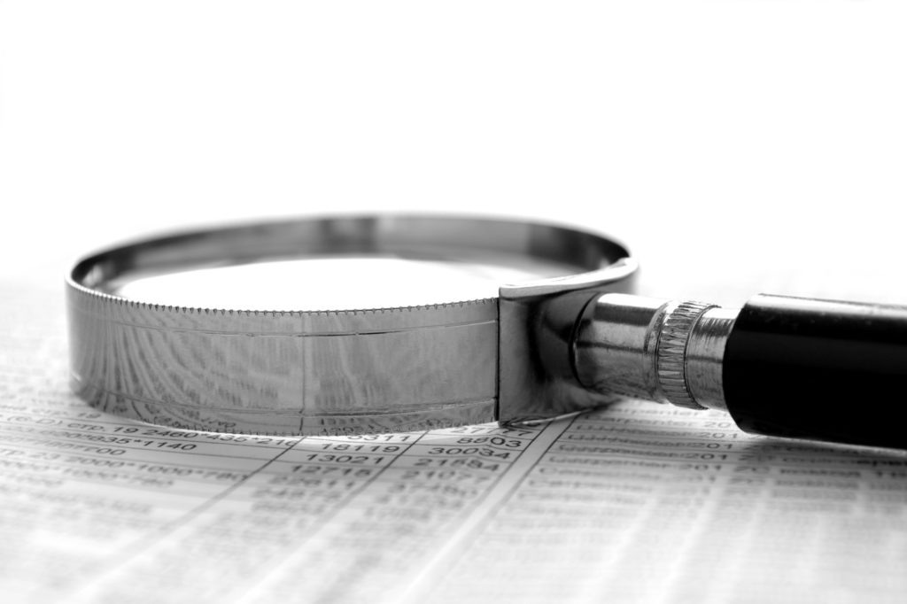 a magnifying glass on top of a chart