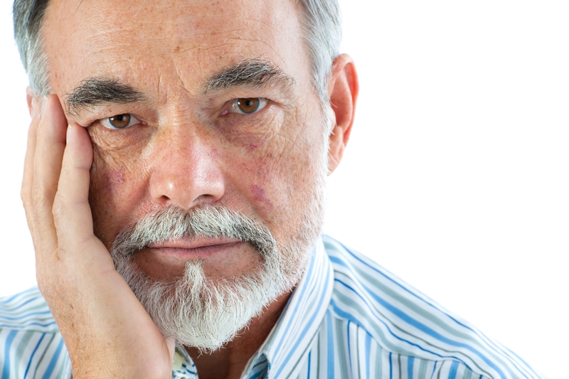 Serious looking elder man